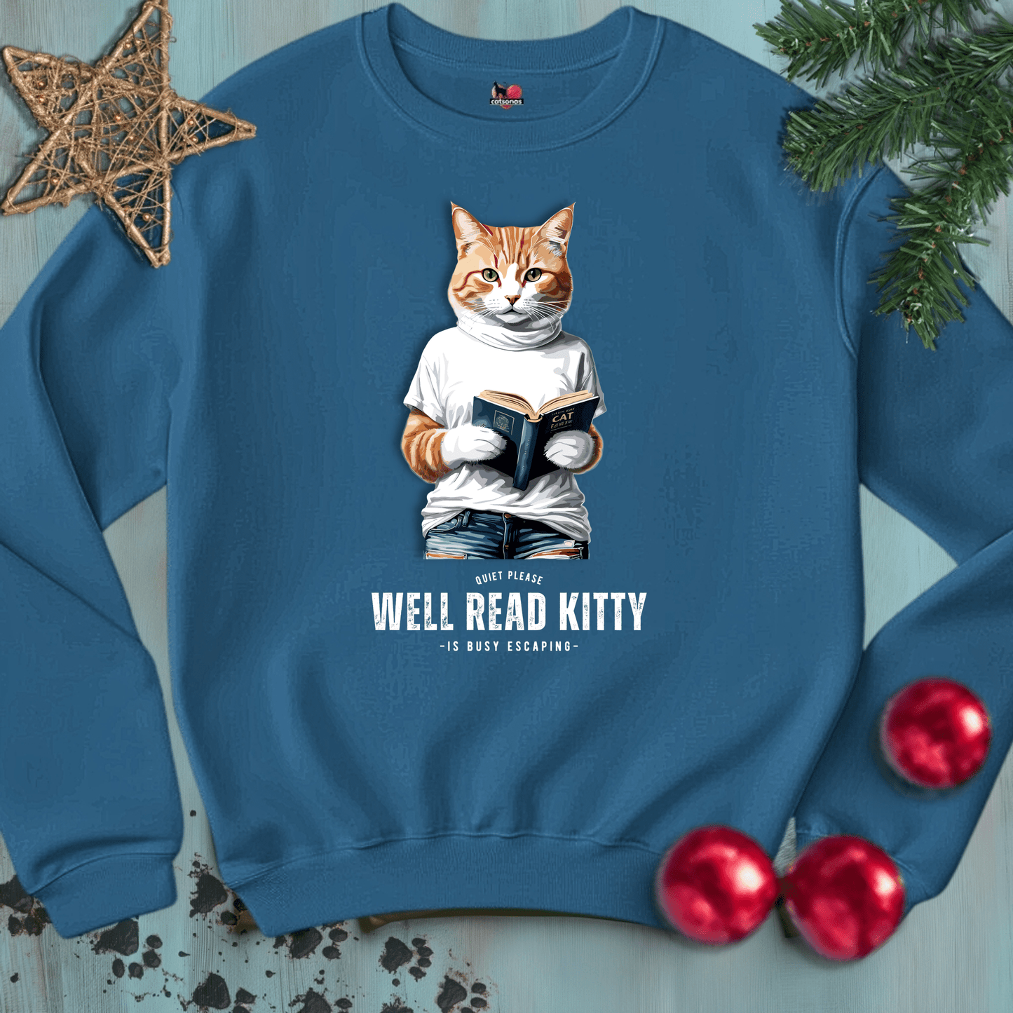 Printify Sweatshirt S / Indigo Blue WELL-READ-KITTY-BLACK-CATSONAS-READING_e114af6c-26d9-44c9-91a8-b139911a2da8